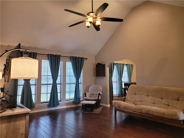 2022 Jenica Dr, Ingleside, TX 78362 - living room with a ceiling fan, arched walkways, hardwood / wood-style flooring, baseboards, and high vaulted ceiling