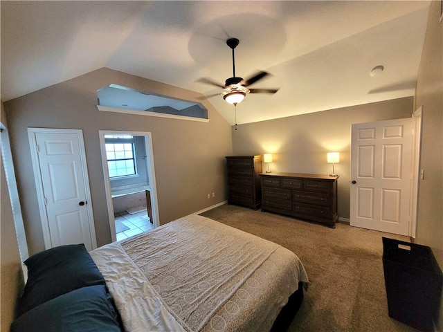2022 Jenica Dr, Ingleside, TX 78362 - carpeted bedroom with lofted ceiling, baseboards, ensuite bath, and a ceiling fan
