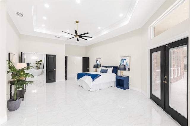 bedroom with a tray ceiling, access to outside, french doors, and visible vents