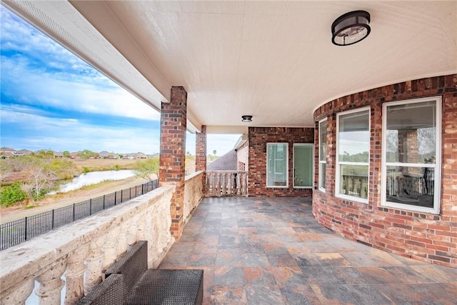 view of patio featuring fence