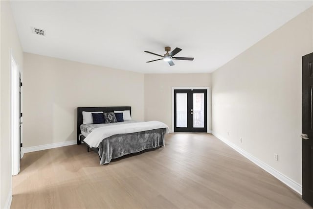 bedroom featuring access to exterior, visible vents, french doors, and baseboards