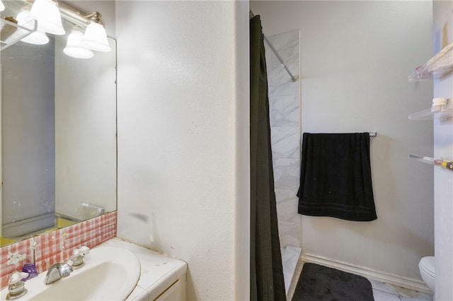 bathroom featuring toilet, a shower with curtain, vanity, and tile patterned flooring