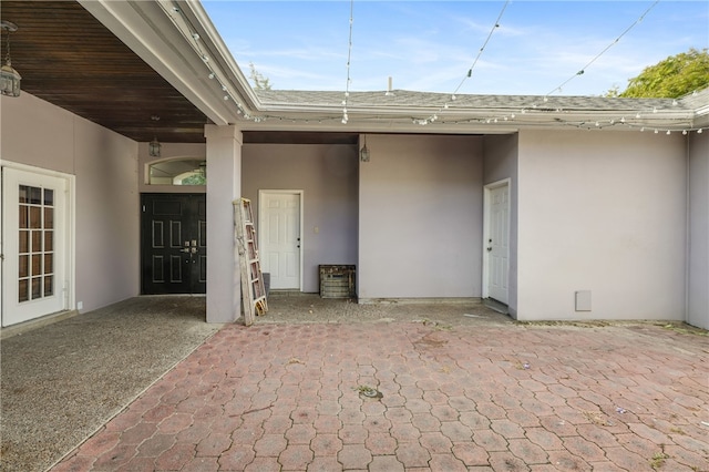 doorway to property with a patio area