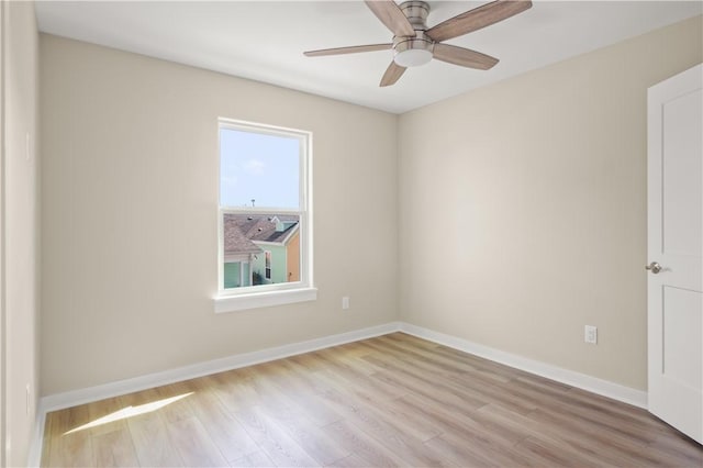 empty room featuring ceiling fan and light wood-type flooring