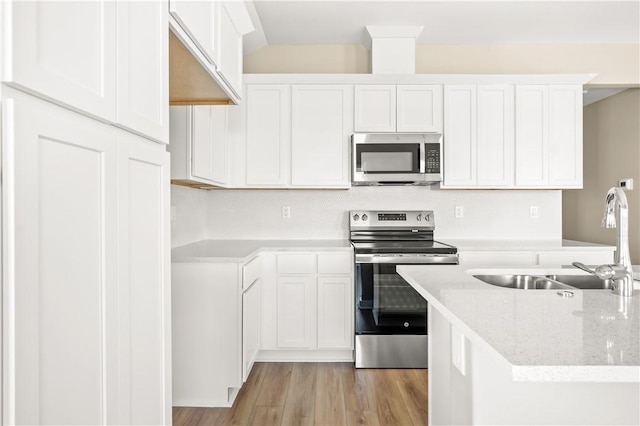 laundry room featuring washer hookup and hardwood / wood-style flooring