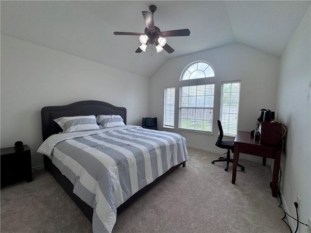 bedroom featuring baseboards, a ceiling fan, vaulted ceiling, and light carpet