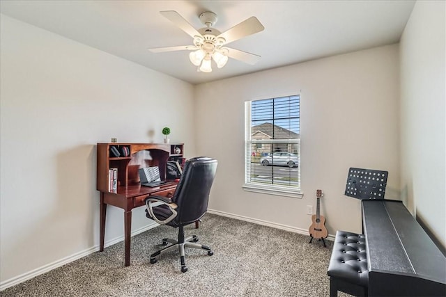 office space featuring ceiling fan and carpet