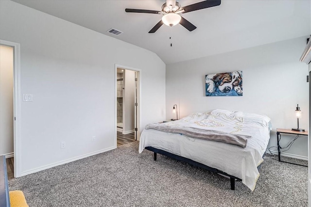 bedroom with ceiling fan, lofted ceiling, and carpet flooring