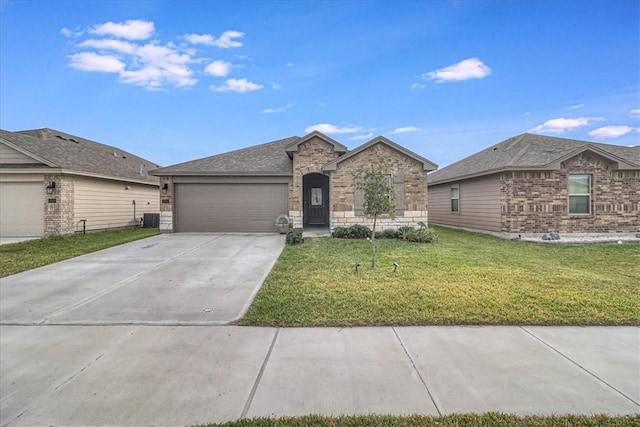 ranch-style house featuring a garage, a front yard, and central air condition unit