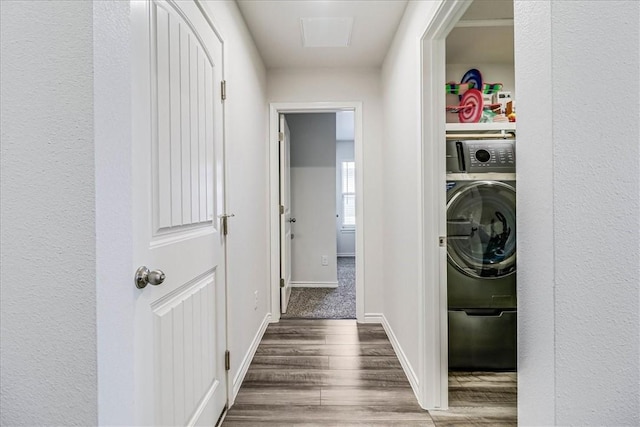 washroom featuring dark hardwood / wood-style flooring and washer / clothes dryer