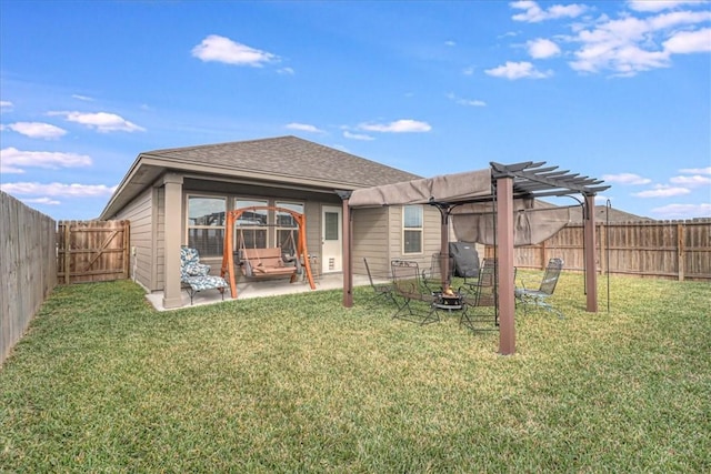 back of house with a pergola, a patio area, and a yard