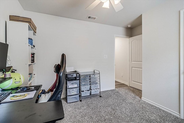 home office with ceiling fan and carpet floors