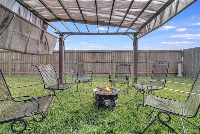 view of yard featuring a pergola and an outdoor fire pit