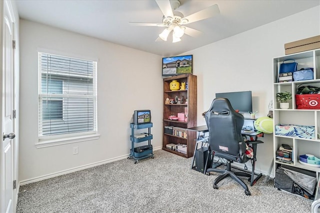 office with carpet floors and ceiling fan