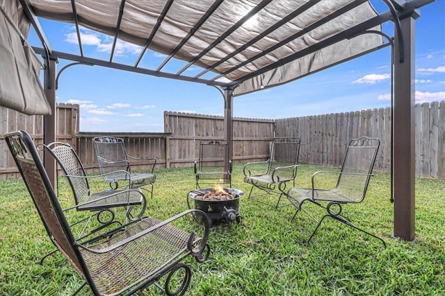 view of yard with an outdoor fire pit and a pergola