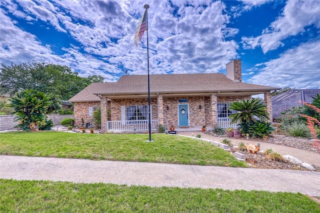 4409 Sue Cir, Corpus Christi, TX 78410 - single story home with brick siding, a front lawn, and covered porch