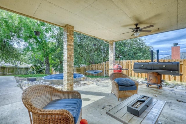 4409 Sue Cir, Corpus Christi, TX 78410 - view of patio featuring a trampoline, a fire pit, a fenced backyard, and ceiling fan