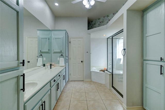 4409 Sue Cir, Corpus Christi, TX 78410 - bathroom with a bath, a ceiling fan, a sink, tile patterned floors, and double vanity