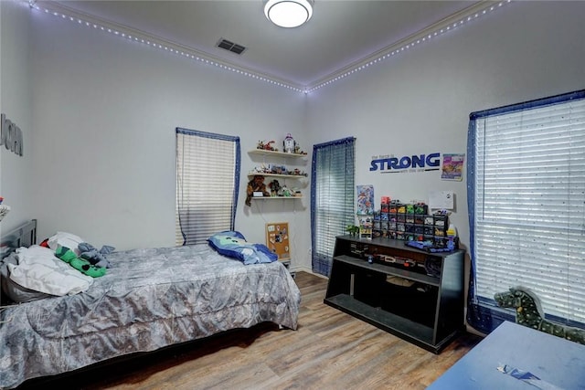 4409 Sue Cir, Corpus Christi, TX 78410 - bedroom featuring visible vents and wood finished floors