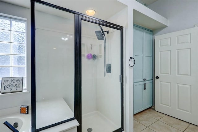 4409 Sue Cir, Corpus Christi, TX 78410 - bathroom featuring a shower stall, tile patterned floors, and a bath