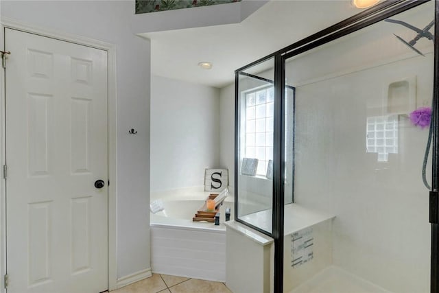 4409 Sue Cir, Corpus Christi, TX 78410 - full bath with tile patterned flooring, a bath, a stall shower, and baseboards