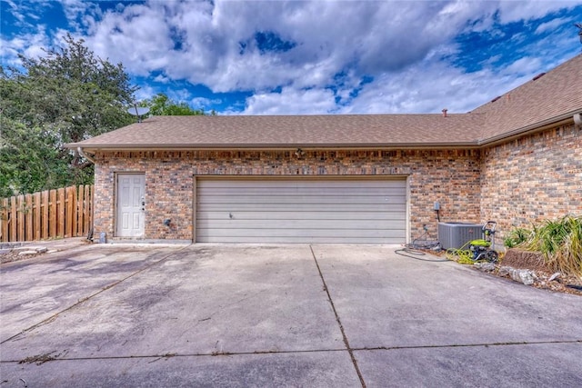 4409 Sue Cir, Corpus Christi, TX 78410 - garage featuring central AC, fence, and driveway