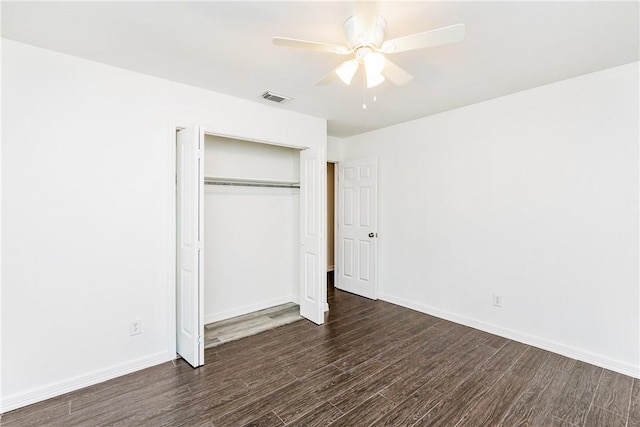 4925 Valley Stream Dr, Corpus Christi, TX 78413 - unfurnished bedroom featuring dark wood finished floors, a closet, baseboards, and a ceiling fan