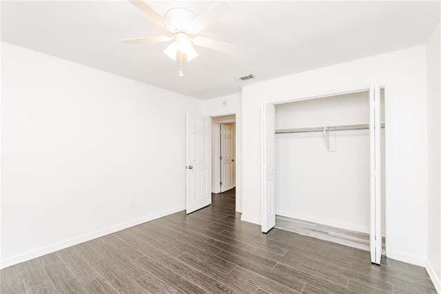 4925 Valley Stream Dr, Corpus Christi, TX 78413 - unfurnished bedroom with wood finished floors, a closet, baseboards, and a ceiling fan