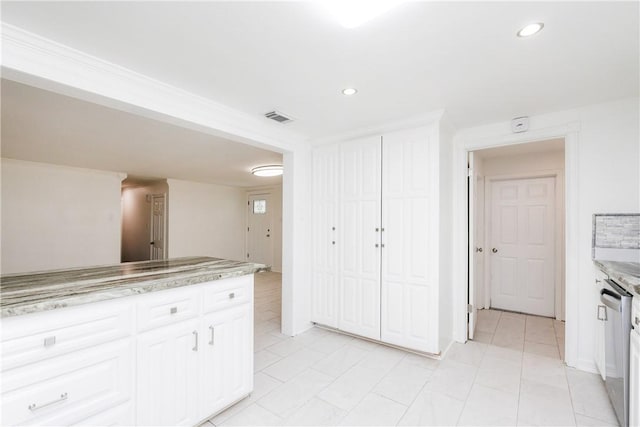 4925 Valley Stream Dr, Corpus Christi, TX 78413 - kitchen with white cabinetry, dishwasher, recessed lighting, light tile patterned floors, and light stone countertops