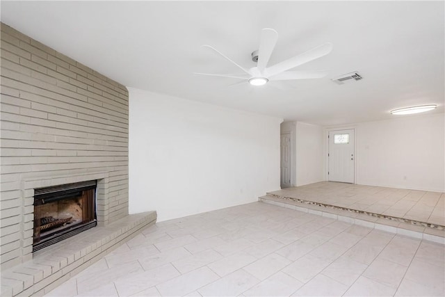 4925 Valley Stream Dr, Corpus Christi, TX 78413 - unfurnished living room featuring a fireplace, ceiling fan, and tile patterned floors