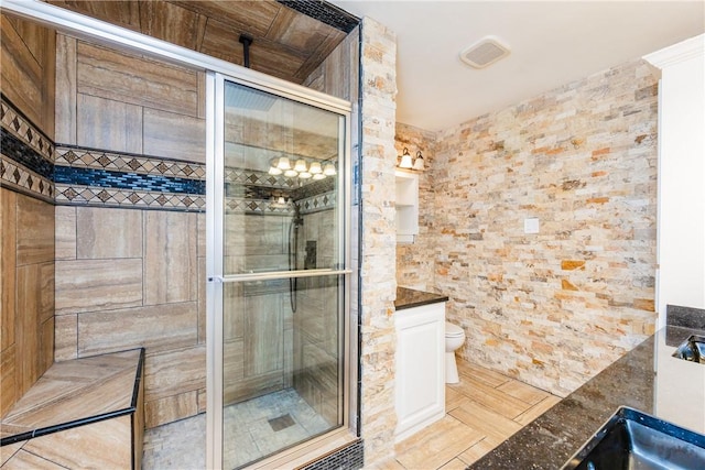 4925 Valley Stream Dr, Corpus Christi, TX 78413 - full bathroom with a stall shower, toilet, and vanity