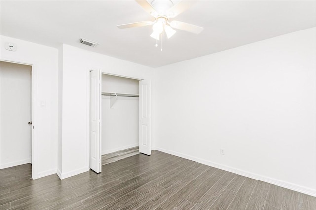 4925 Valley Stream Dr, Corpus Christi, TX 78413 - unfurnished bedroom featuring wood finished floors, a closet, baseboards, and a ceiling fan