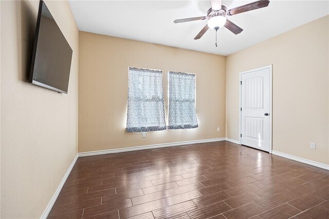 3813 Elvis Dr, Corpus Christi, TX 78414 - spare room featuring dark wood-style floors, baseboards, and ceiling fan