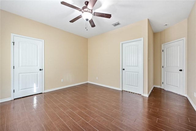 3813 Elvis Dr, Corpus Christi, TX 78414 - unfurnished bedroom with baseboards, dark wood-style flooring, and a ceiling fan
