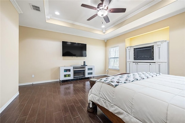 3813 Elvis Dr, Corpus Christi, TX 78414 - bedroom featuring baseboards, wood finished floors, crown molding, a raised ceiling, and recessed lighting