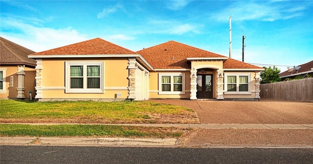 3813 Elvis Dr, Corpus Christi, TX 78414 - view of front facade featuring stucco siding