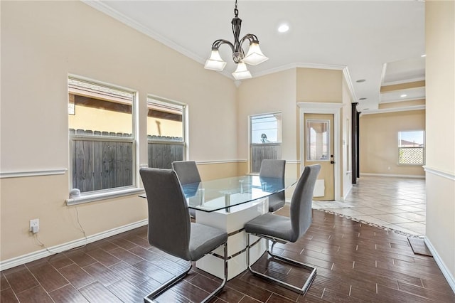 3813 Elvis Dr, Corpus Christi, TX 78414 - dining room featuring a chandelier, crown molding, baseboards, wood tiled floors, and recessed lighting