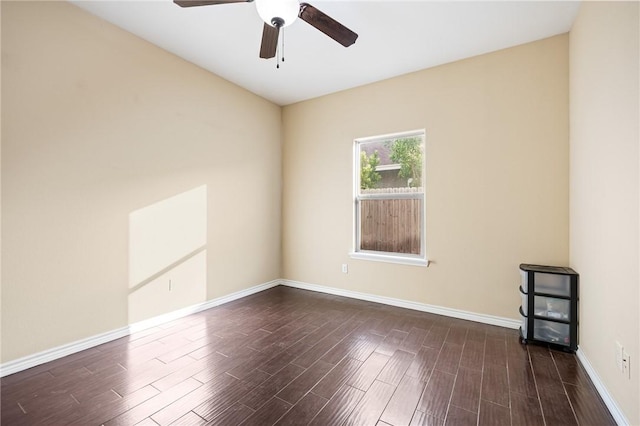 3813 Elvis Dr, Corpus Christi, TX 78414 - spare room featuring dark wood-style floors, a ceiling fan, and baseboards
