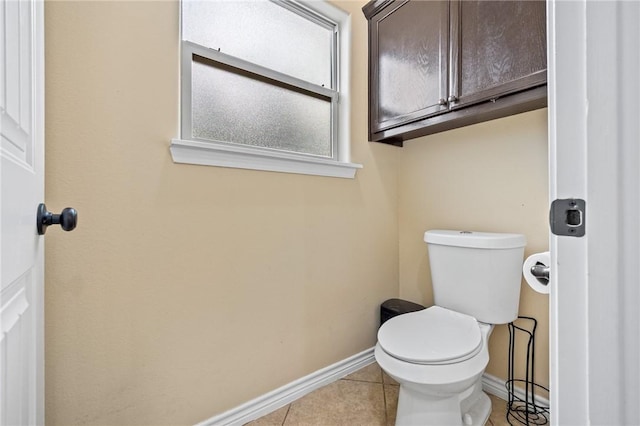3813 Elvis Dr, Corpus Christi, TX 78414 - bathroom featuring baseboards, toilet, and tile patterned flooring
