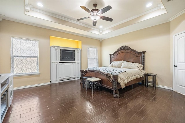 3813 Elvis Dr, Corpus Christi, TX 78414 - bedroom featuring a tray ceiling, multiple windows, dark wood finished floors, crown molding, and recessed lighting