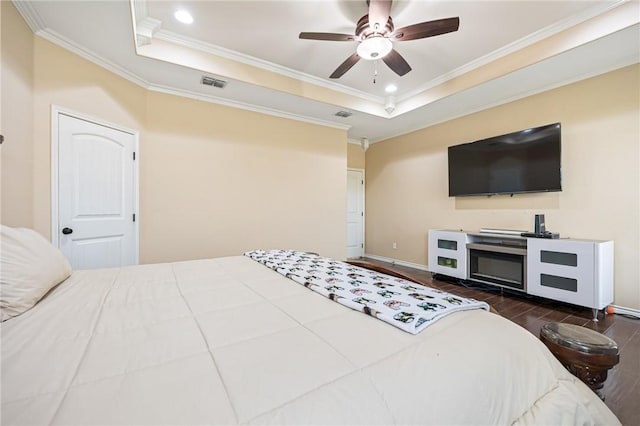 3813 Elvis Dr, Corpus Christi, TX 78414 - bedroom with a raised ceiling, ornamental molding, wood finished floors, baseboards, and ceiling fan