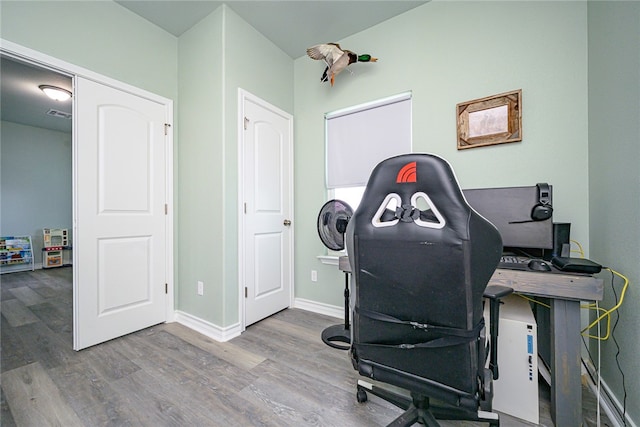 office space with hardwood / wood-style flooring