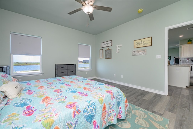 bedroom featuring hardwood / wood-style flooring and ceiling fan