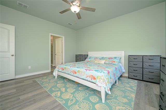 bedroom with hardwood / wood-style flooring and ceiling fan