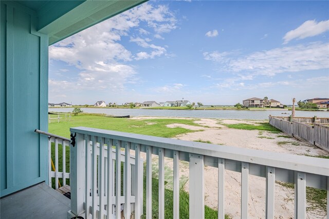 balcony featuring a water view