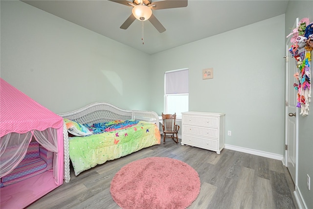 bedroom featuring hardwood / wood-style floors and ceiling fan