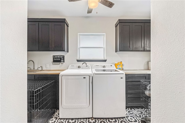 washroom featuring tile patterned floors, cabinets, sink, washing machine and clothes dryer, and ceiling fan