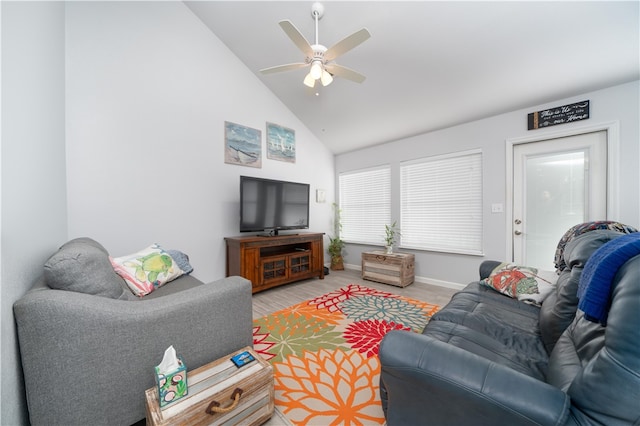 living room featuring high vaulted ceiling and ceiling fan