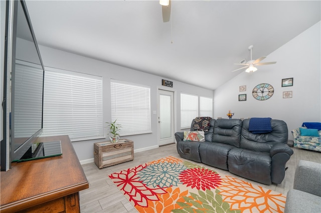 living room featuring light hardwood / wood-style floors, lofted ceiling, and ceiling fan