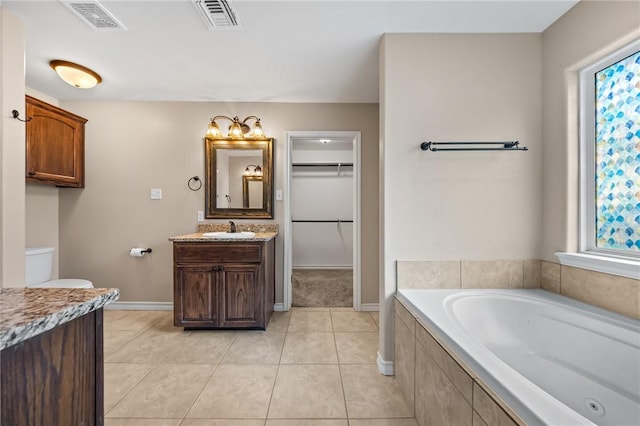 7406 Brush Creek Dr, Corpus Christi, TX 78414 - bathroom with vanity, a bath, healthy amount of natural light, and tile patterned floors